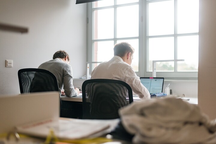 Students learning from behind