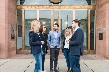 Group of people in front of the university entrance