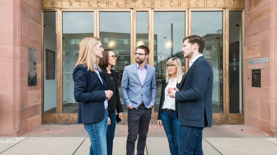 Group of people in front of the university entrance
