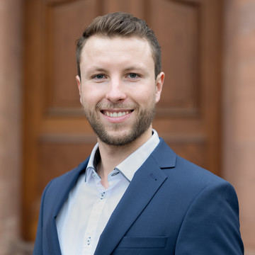 MISES doctoral student Philip Holler